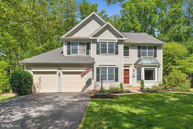13213 Windy Leaf Ct, Woodbridge, VA 22192 - view of front facade with an attached garage, a front lawn, aphalt driveway, and roof with shingles