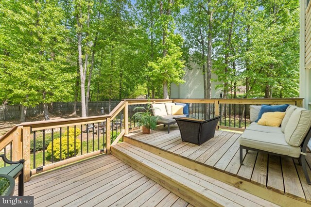 13213 Windy Leaf Ct, Woodbridge, VA 22192 - wooden deck featuring an outdoor living space and a fenced backyard