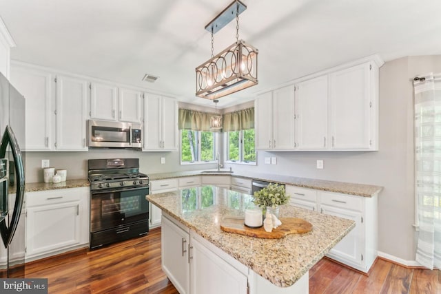 13213 Windy Leaf Ct, Woodbridge, VA 22192 - kitchen featuring white cabinetry, appliances with stainless steel finishes, and wood finished floors