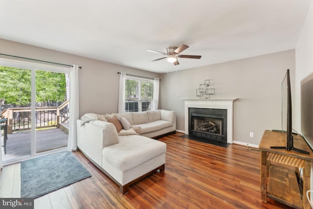 13213 Windy Leaf Ct, Woodbridge, VA 22192 - living room with a ceiling fan, a fireplace with flush hearth, and wood finished floors