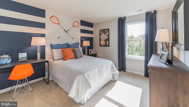 bedroom featuring baseboards, light colored carpet, and visible vents