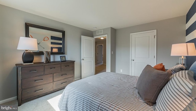 bedroom featuring light colored carpet, baseboards, and visible vents