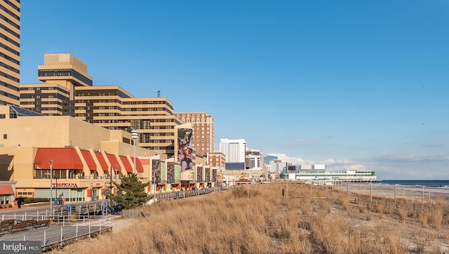 view of property featuring a water view and a view of city
