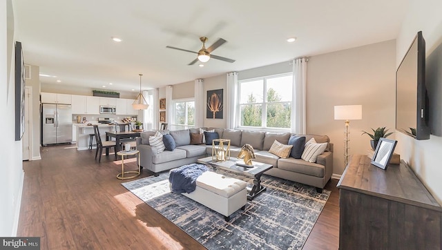 living area with recessed lighting, ceiling fan, and dark wood-style floors