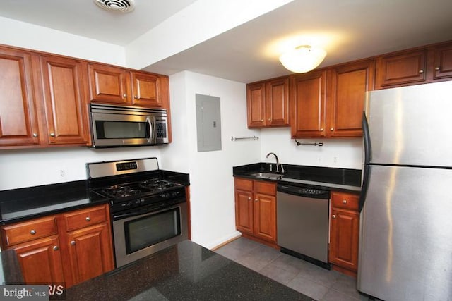 8710 Manchester Rd Unit 1, Silver Spring, MD 20901 - kitchen featuring appliances with stainless steel finishes, a sink, tile patterned flooring, visible vents, and electric panel