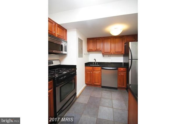 8710 Manchester Rd Unit 1, Silver Spring, MD 20901 - kitchen featuring dark countertops, appliances with stainless steel finishes, and a sink