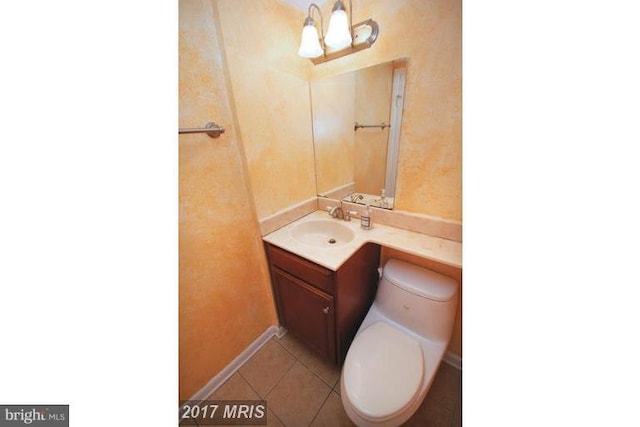 8710 Manchester Rd Unit 1, Silver Spring, MD 20901 - bathroom with toilet, tile patterned floors, and vanity