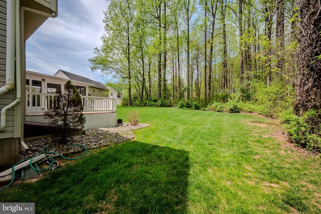 view of yard featuring a wooden deck