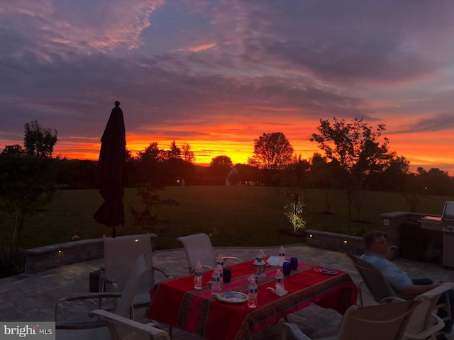 view of patio terrace at dusk