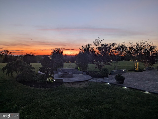 view of yard with a fire pit and a patio area