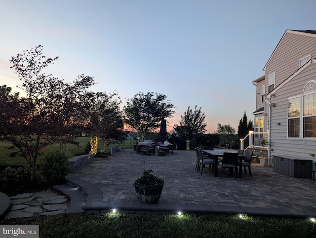 view of patio terrace at dusk