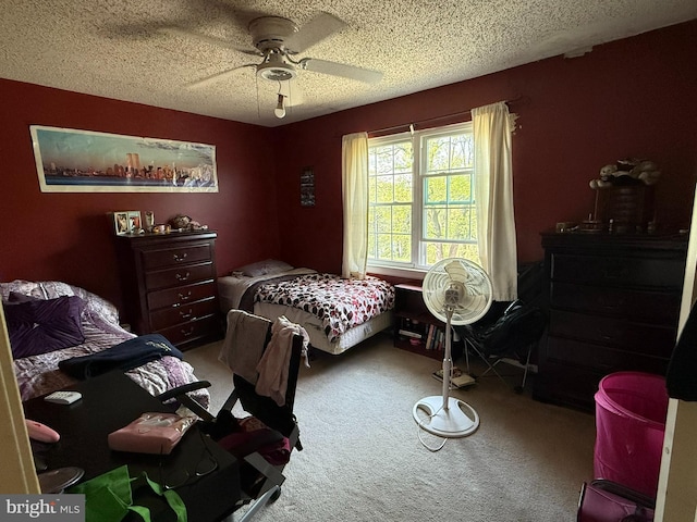 carpeted bedroom with a textured ceiling and ceiling fan