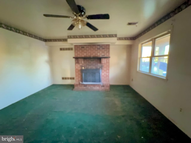 unfurnished living room with carpet flooring, ceiling fan, and a fireplace