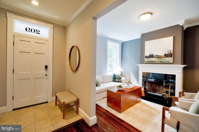 209 11th St NE, Washington, DC 20002 - entrance foyer with crown molding, baseboards, wood finished floors, and a glass covered fireplace