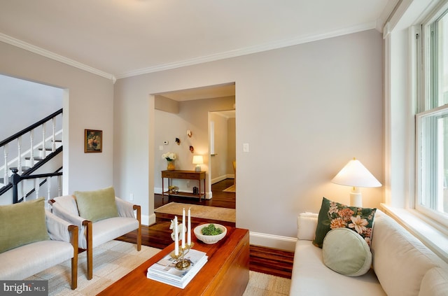 209 11th St NE, Washington, DC 20002 - living room with light wood finished floors, crown molding, baseboards, and stairway