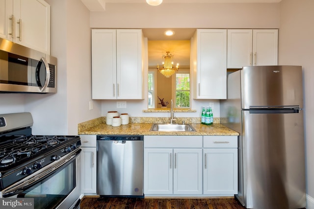 209 11th St NE, Washington, DC 20002 - kitchen featuring appliances with stainless steel finishes, a sink, white cabinetry, and recessed lighting