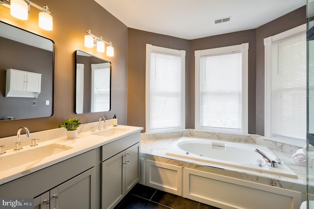 209 11th St NE, Washington, DC 20002 - bathroom with a bath, double vanity, and tile patterned flooring