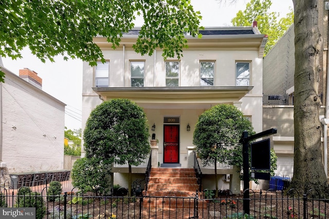 209 11th St NE, Washington, DC 20002 - view of front of property featuring a fenced front yard and brick siding