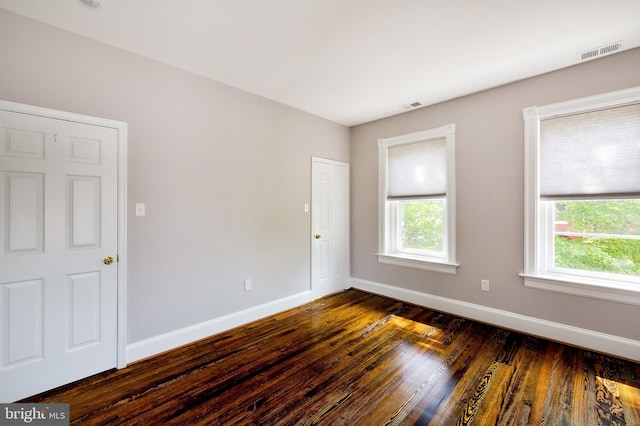209 11th St NE, Washington, DC 20002 - unfurnished room with dark wood-style floors, baseboards, and healthy amount of natural light
