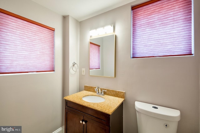 209 11th St NE, Washington, DC 20002 - bathroom with vanity, toilet, and plenty of natural light