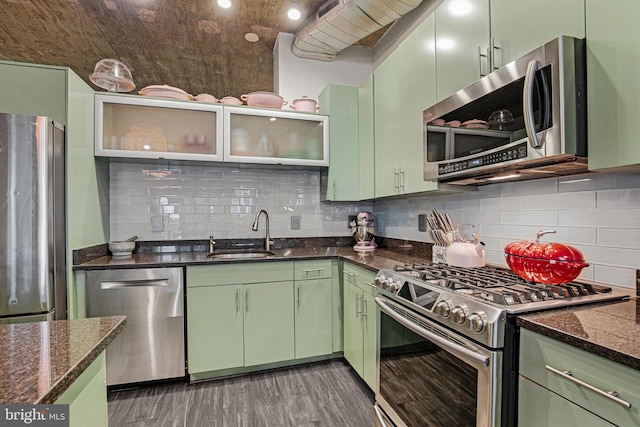929 Florida Ave NW Unit 2001, Washington, DC 20001 - kitchen featuring a sink, stainless steel appliances, wood finished floors, backsplash, and green cabinets