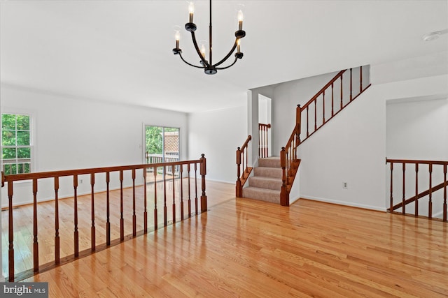 7232 Cherwell Ln, Alexandria, VA 22315 - staircase with wood finished floors, a chandelier, and baseboards