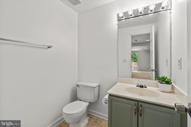 7232 Cherwell Ln, Alexandria, VA 22315 - half bathroom featuring toilet, baseboards, and vanity