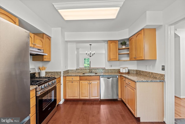 7232 Cherwell Ln, Alexandria, VA 22315 - kitchen with appliances with stainless steel finishes, a sink, under cabinet range hood, and dark wood-style floors