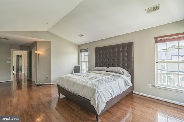 907 Whistling Duck Dr, Upper Marlboro, MD 20774 - bedroom with visible vents, baseboards, vaulted ceiling, and hardwood / wood-style flooring