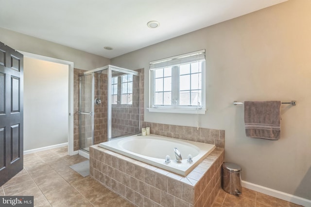 907 Whistling Duck Dr, Upper Marlboro, MD 20774 - bathroom featuring tile patterned floors, baseboards, a shower stall, and a bath