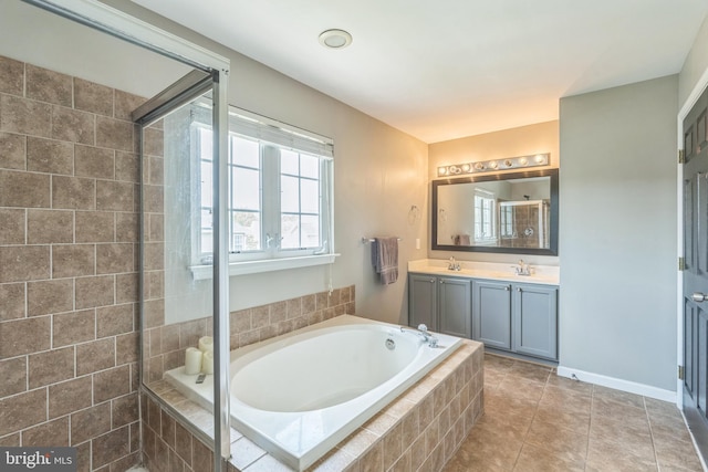 907 Whistling Duck Dr, Upper Marlboro, MD 20774 - full bathroom with vanity, tile patterned flooring, a tile shower, and a bath
