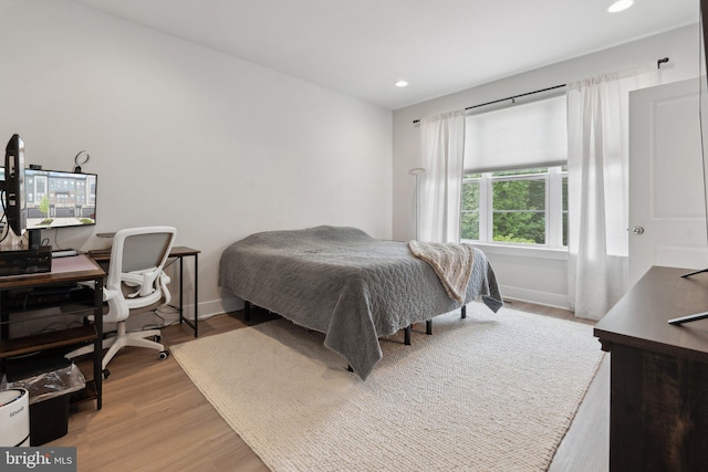 bedroom featuring recessed lighting, light wood-style flooring, and baseboards