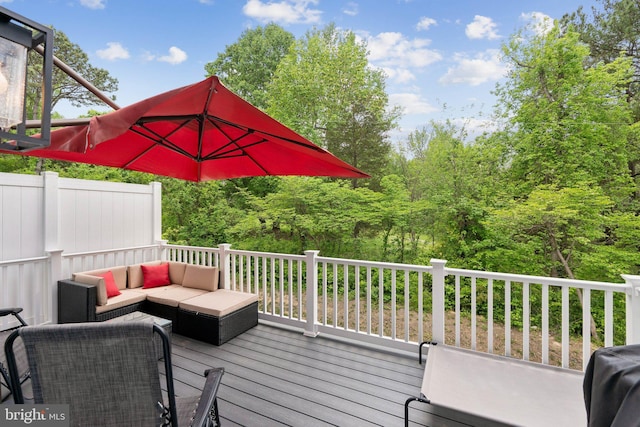 wooden terrace with an outdoor hangout area