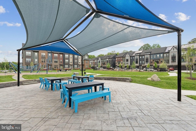 view of home's community with a lawn and a residential view