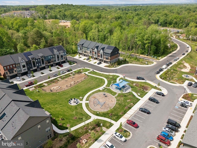 bird's eye view featuring a wooded view