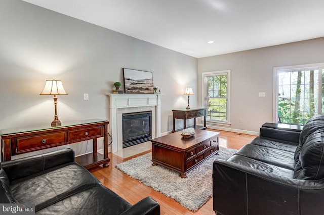 5985 Twin Branch Ct, Haymarket, VA 20169 - living room featuring baseboards, a fireplace with flush hearth, light wood-style flooring, and recessed lighting