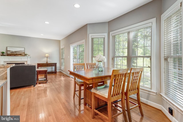 5985 Twin Branch Ct, Haymarket, VA 20169 - dining area with baseboards, recessed lighting, light wood-style flooring, and a fireplace