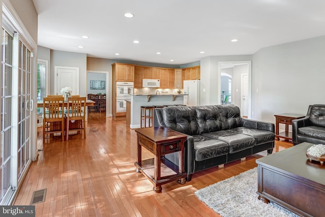 5985 Twin Branch Ct, Haymarket, VA 20169 - living area featuring visible vents, recessed lighting, and light wood-style flooring
