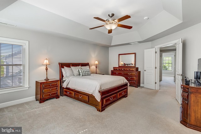 5985 Twin Branch Ct, Haymarket, VA 20169 - bedroom with light colored carpet, a ceiling fan, baseboards, a tray ceiling, and visible vents