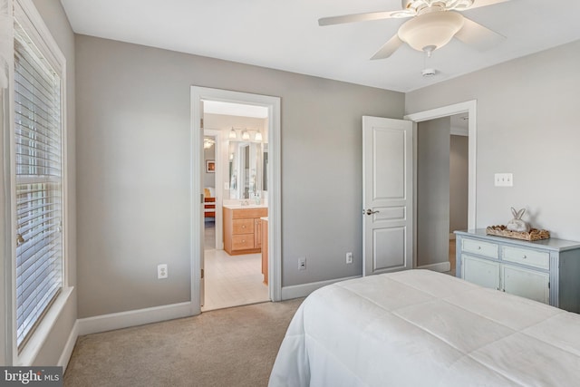 5985 Twin Branch Ct, Haymarket, VA 20169 - carpeted bedroom with baseboards, connected bathroom, and multiple windows