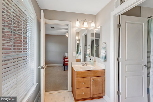 5985 Twin Branch Ct, Haymarket, VA 20169 - bathroom featuring vanity, tile patterned flooring, visible vents, baseboards, and ceiling fan