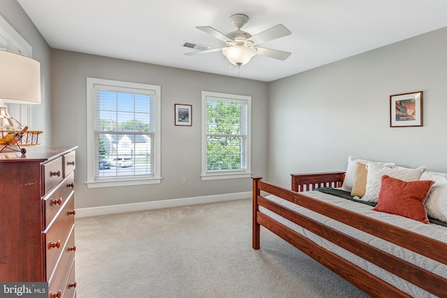 5985 Twin Branch Ct, Haymarket, VA 20169 - bedroom with baseboards, light carpet, and visible vents