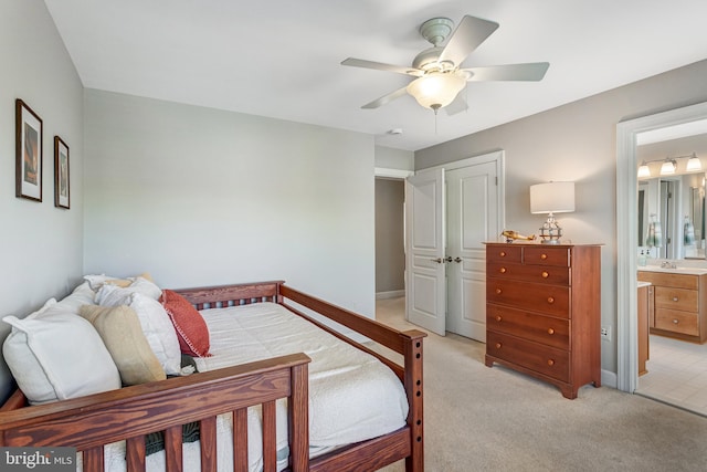 5985 Twin Branch Ct, Haymarket, VA 20169 - bedroom with light carpet, a ceiling fan, baseboards, ensuite bathroom, and a closet