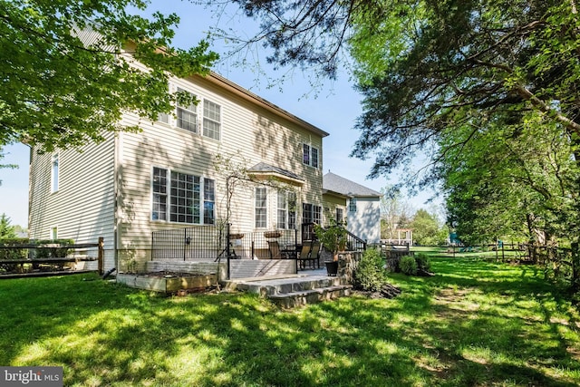 5985 Twin Branch Ct, Haymarket, VA 20169 - back of property with a fenced backyard, a patio area, and a yard