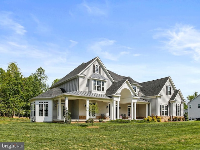 2204 Messina Ct, Eldersburg, MD 21784 - view of front of property featuring a standing seam roof, metal roof, a shingled roof, and a front yard