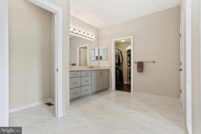 2204 Messina Ct, Eldersburg, MD 21784 - full bathroom with a spacious closet, baseboards, vanity, and marble finish floors