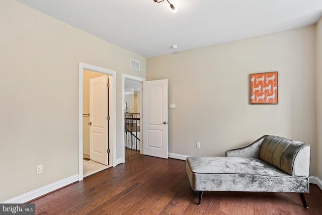 2204 Messina Ct, Eldersburg, MD 21784 - sitting room with dark wood-style floors, an upstairs landing, and baseboards