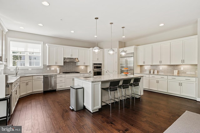 2204 Messina Ct, Eldersburg, MD 21784 - kitchen with appliances with stainless steel finishes, a sink, backsplash, dark wood-style flooring, and recessed lighting