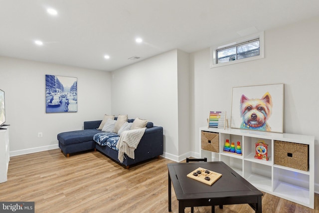 interior space with recessed lighting, baseboards, visible vents, and light wood finished floors