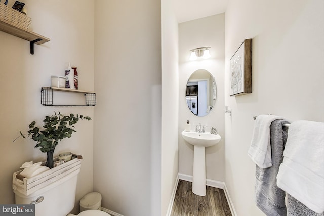520 View Point Way, Fredericksburg, VA 22405 - half bath with toilet, wood finished floors, baseboards, and a sink